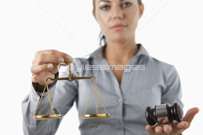 Scale and gavel being held by female lawyer