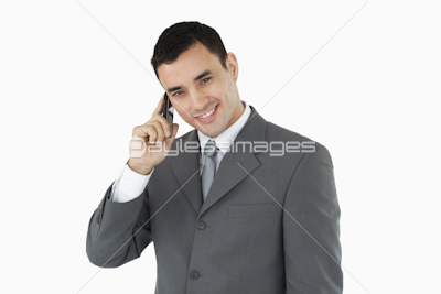 Smiling businessman on his phone