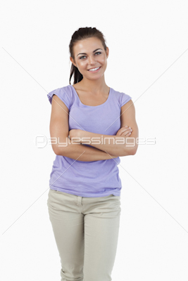 Smiling young female with arms folded