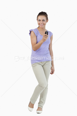 Smiling young female with her cellphone