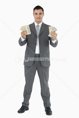 Successful businessman presenting banknotes