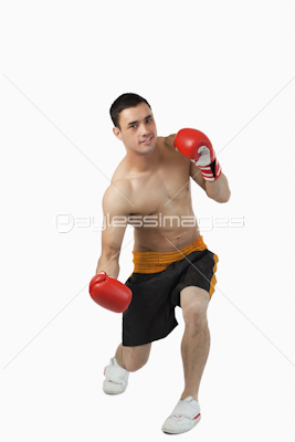 Young boxer starting to perform uppercut