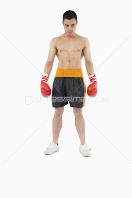 Young boxer with strong fighting spirit