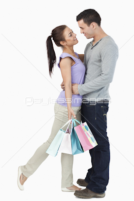 Young couple hugging during shopping tour