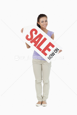 Young female holding a sales sign