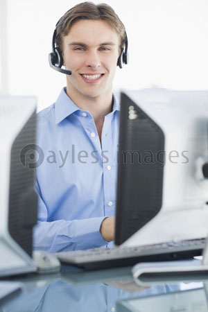 Male .... Perform the headset of a desk by using computer.