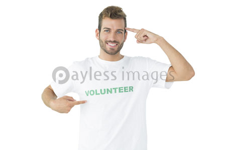 The portrait of the volunteer of the happy man who points himself out