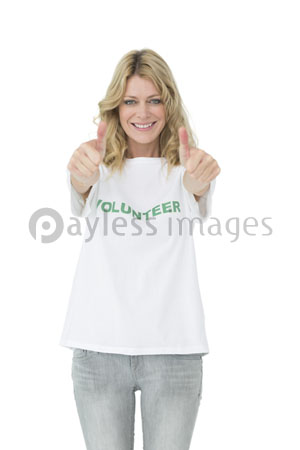 The portrait of the volunteer of the happy woman who expresses the thumb by gesture