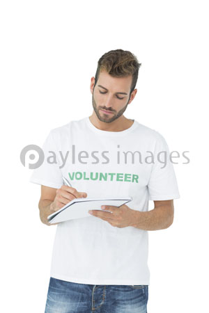 The young man's volunteer is writing the note.