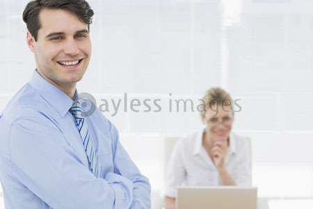 What it smiles and expresses a businessman for (a woman working back in an office)