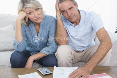 Worried couple going over bills