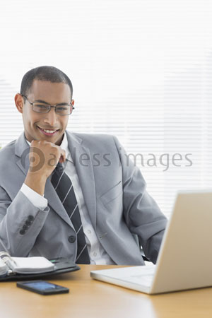 confidence with the laptop of the office desk -- a businessman [ being full ]