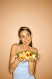 Woman+holding+fruit+plate.