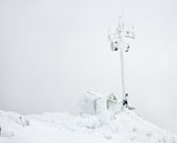 Cabin+and+antenna+in+snow.