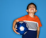 Male+boy+holding+soccer+ball.