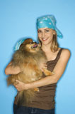 Teen+girl+holding+Pomeranian+dog.