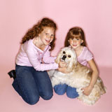 Girls+holding+Cocker+Spaniel+dog.
