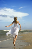 Girl+running+down+the+beach.