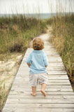 Little+boy+on+beach+walkway.