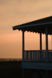 Beachfront+porch+silhouetted+at+sunset