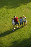 Family+standing+on+lawn.