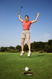 Happy+woman+golfing.