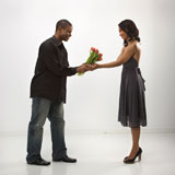 Man+giving+woman+flowers.