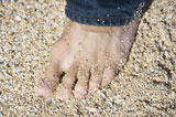 Male+foot+on+beach.