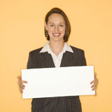 Businesswoman+holding+blank+sign.
