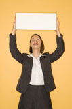 Businesswoman+holding+blank+sign.
