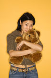 Woman+holding+teddy+bear.