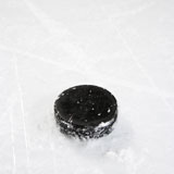 Hockey+puck+on+ice.