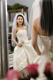 Bride+admiring+dress.