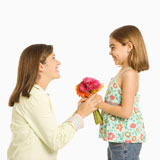 Daughter+giving+mother+flowers.