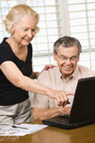 Mature+couple+with+laptop.