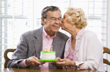 Mature+couple+with+cake.