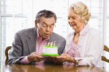 Mature+couple+with+cake.