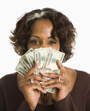 Woman+holding+cash.
