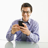 Smiling+businessman+on+cell+phone