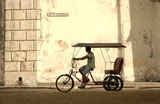 A+man+riding+a+pedicab%2C+Havana%2C+Cuba