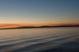Silhouette+of+shoreline+against+twilight+sky