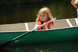 Small+child+holding+a+paddle+in+a+canoe
