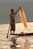 Fisherman+standing+with+fishing+net