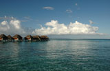 Panoramic+view+of+thatched+buildings+on+stilts+in+the+sea%2C+Moorea%2C+Tahiti%2C+French+Polynesia%2C+South+Pacific