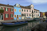 An+array+of+colorful+residential+buildings+in+Venice%2C+Burano%2C+Italy