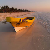 Boat+on+the+beach+at+sunset