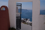 Ocean+view+through+doorway+in+Santorini+Greece