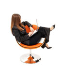 elegant+businesswoman+with+laptop+in+orange+chair