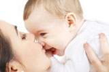 happy+mother+kissing+baby+boy