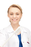 attractive female doctor with toothbrush